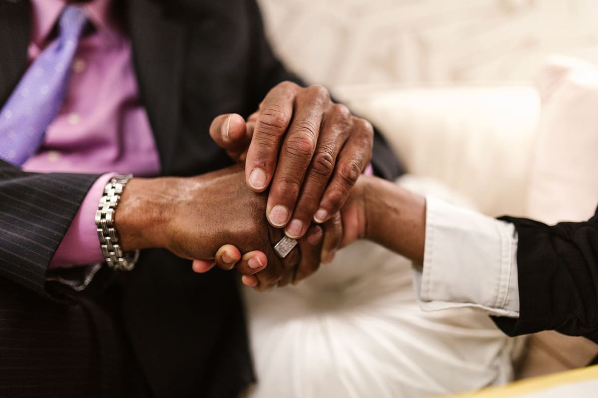 Two people shaking hands to close an agreement